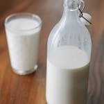 Bottle and glass of milk at home